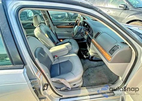 2001 Lincoln Continental z USA, uszkodzony, nr VIN 1LNHM97V71Y604107